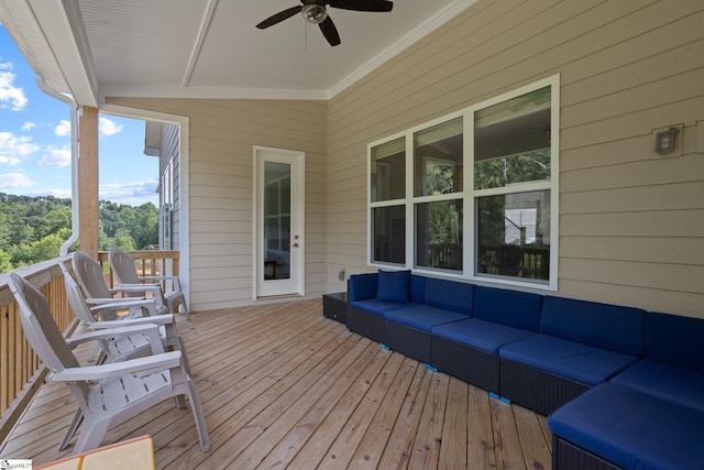 deck with an outdoor living space and ceiling fan