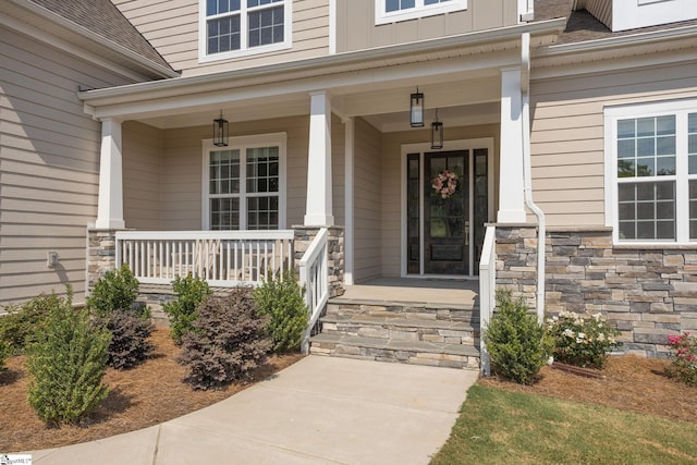 doorway to property featuring covered porch