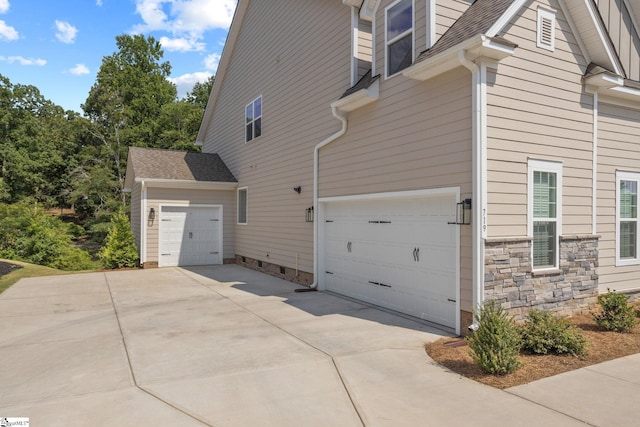 view of property exterior featuring a garage