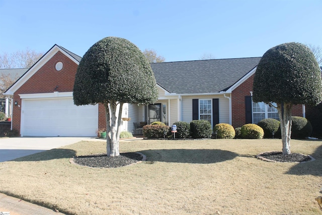 view of front facade with a front yard and a garage