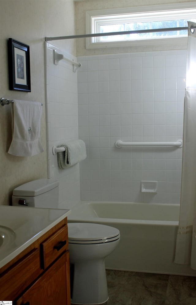 full bathroom featuring tile patterned floors, vanity, shower / bath combination with curtain, and toilet