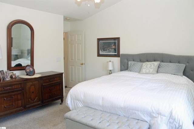 bedroom with light carpet and ceiling fan