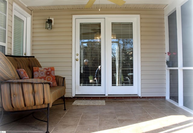 property entrance with ceiling fan and a patio