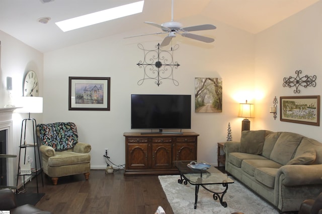 living room with a skylight, ceiling fan, high vaulted ceiling, and dark hardwood / wood-style floors