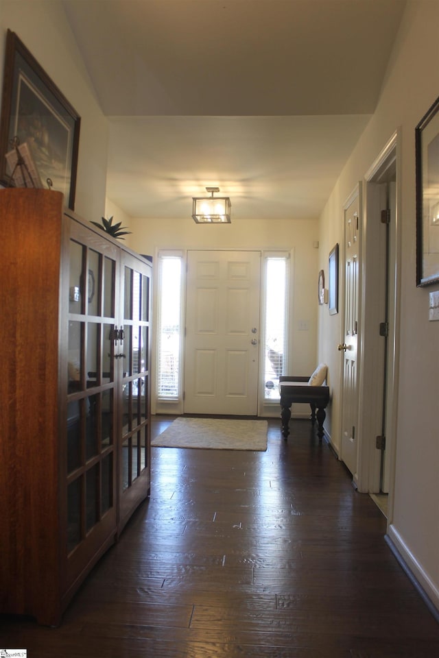 entryway with dark hardwood / wood-style floors and french doors