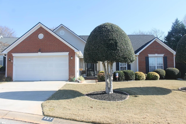 view of front of house with a garage and a front yard