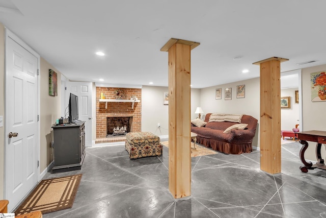 living room with a brick fireplace