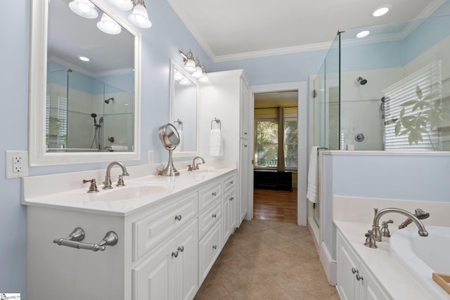 bathroom featuring tile patterned floors, vanity, ornamental molding, and independent shower and bath