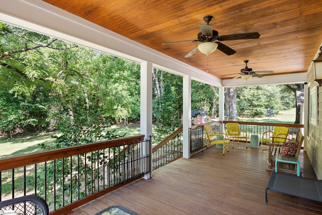 deck featuring covered porch and ceiling fan