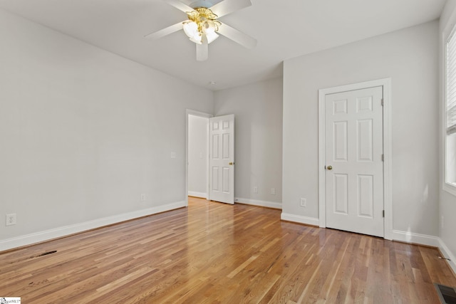 unfurnished room featuring light hardwood / wood-style flooring, ceiling fan, and a healthy amount of sunlight