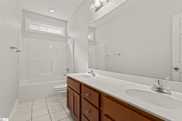 full bathroom featuring tile patterned floors, vanity, toilet, and shower / washtub combination