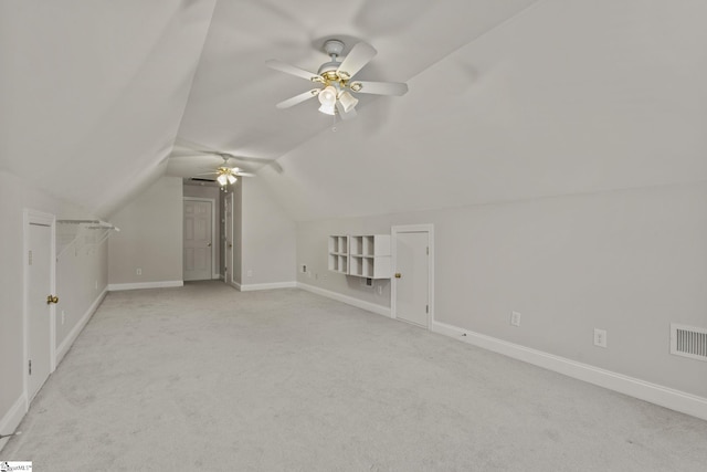 bonus room featuring ceiling fan, light colored carpet, and vaulted ceiling