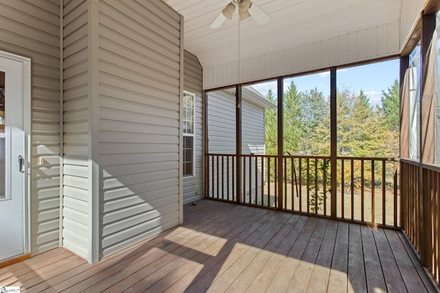 unfurnished sunroom featuring ceiling fan and wood ceiling