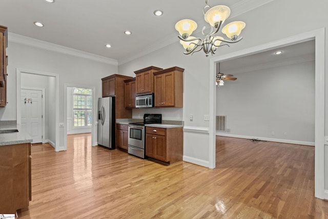 kitchen with ornamental molding, stainless steel appliances, ceiling fan with notable chandelier, and light wood-type flooring