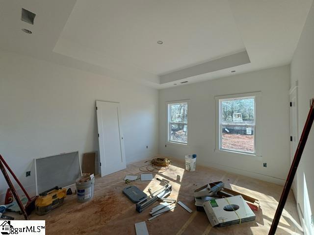 interior space with a tray ceiling