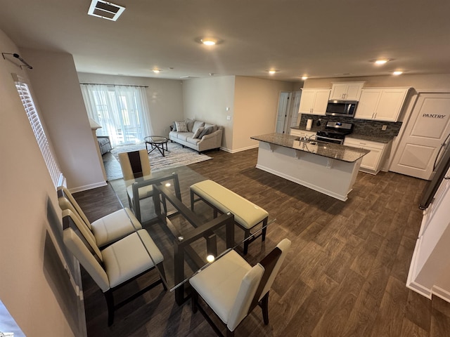 living room with dark hardwood / wood-style floors