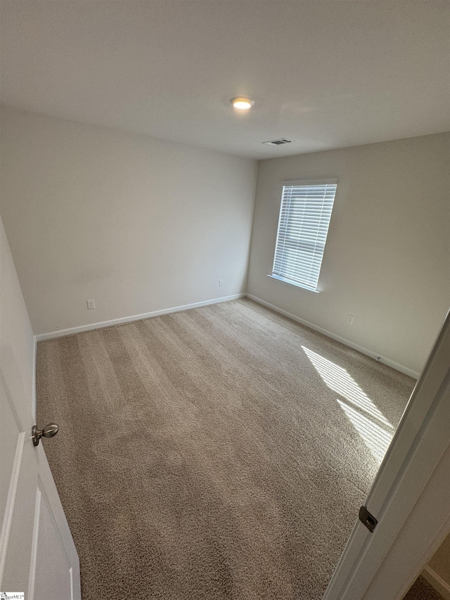 spare room featuring carpet flooring