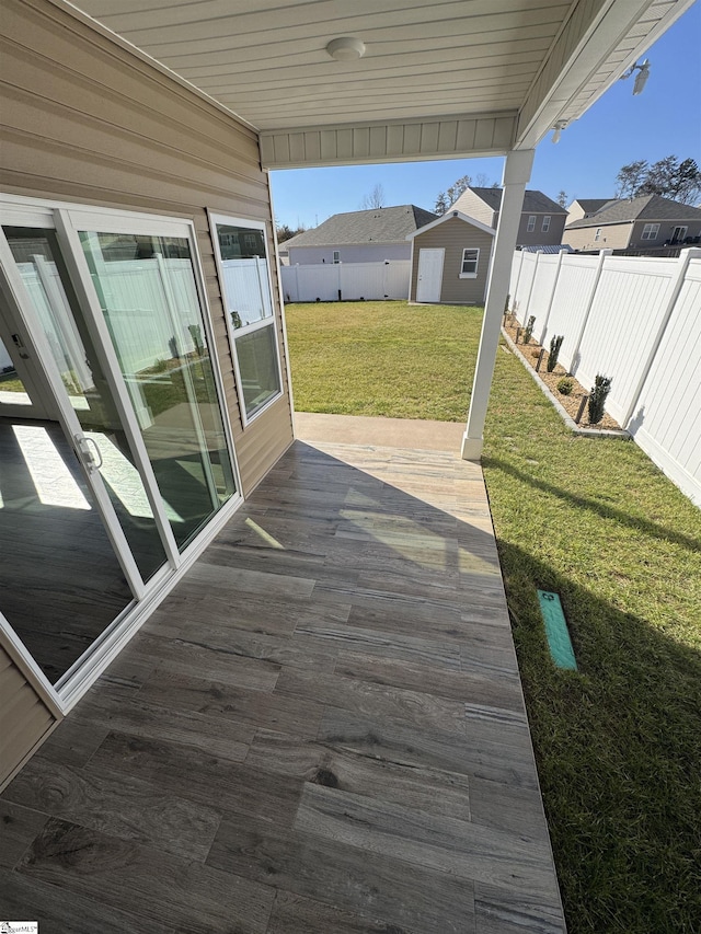 wooden deck featuring a yard