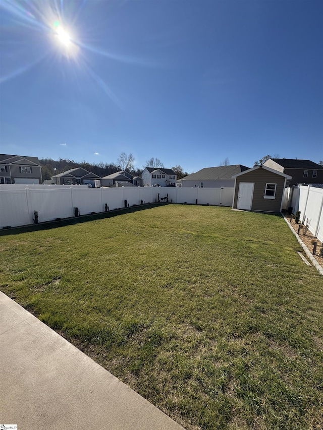 view of yard with a storage shed