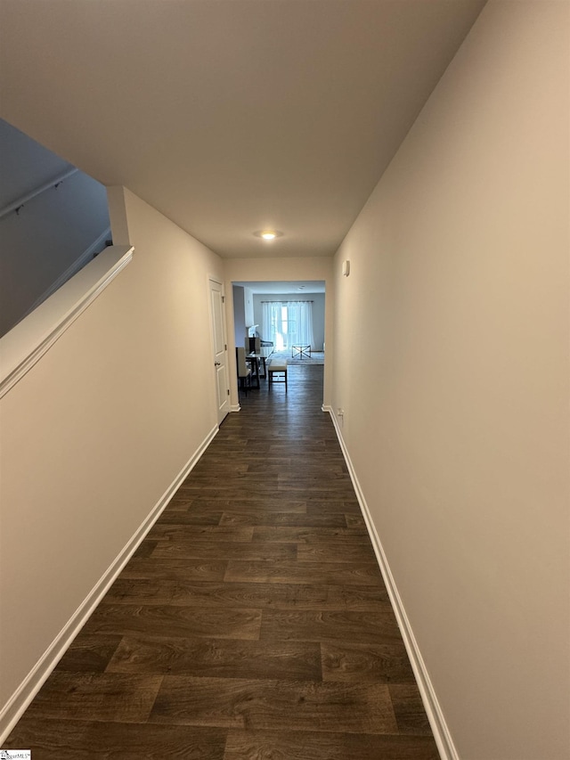 hallway featuring dark hardwood / wood-style flooring