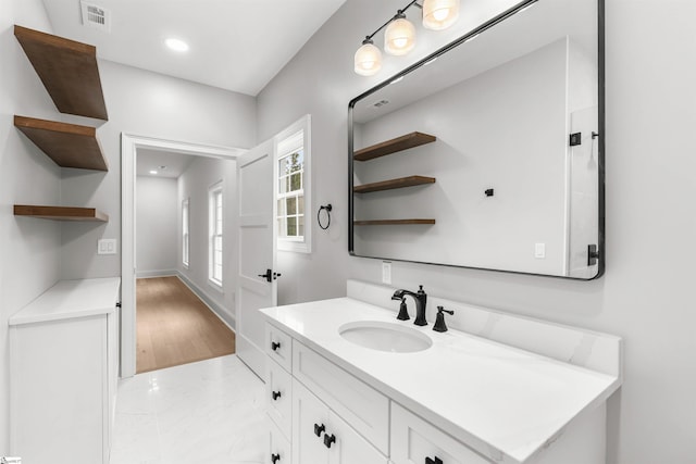 bathroom featuring vanity and hardwood / wood-style flooring