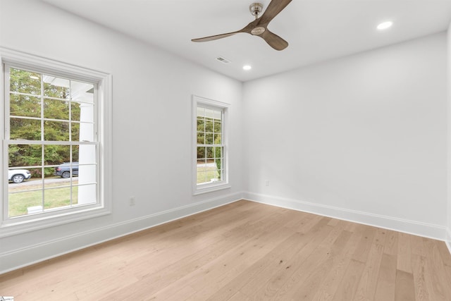 unfurnished room with ceiling fan and light wood-type flooring