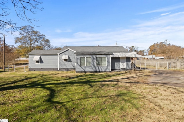 back of house with a lawn