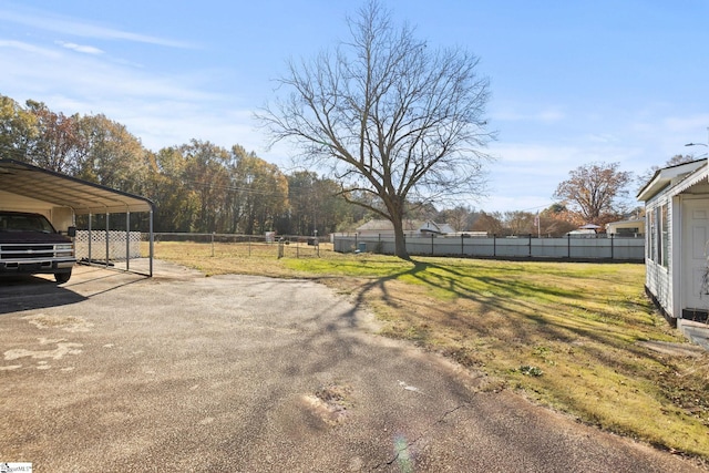 view of yard featuring a carport