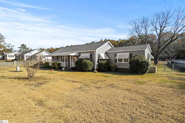 view of side of home with a lawn