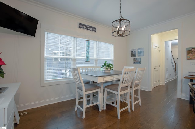 dining room featuring a chandelier, dark hardwood / wood-style flooring, and ornamental molding