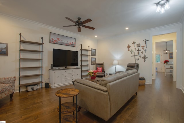 living room with ceiling fan with notable chandelier, dark hardwood / wood-style floors, and ornamental molding