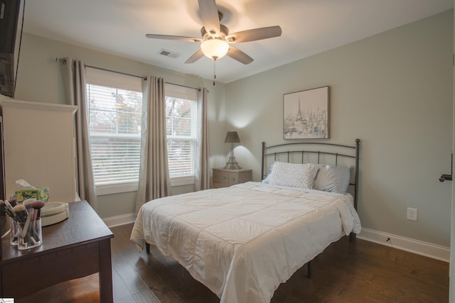 bedroom featuring ceiling fan and dark wood-type flooring