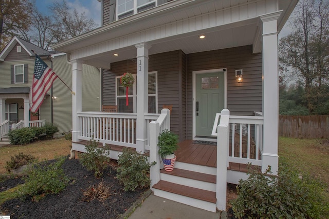 view of exterior entry with covered porch