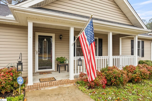 property entrance featuring covered porch