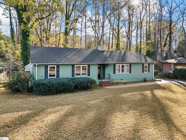 single story home featuring a front lawn