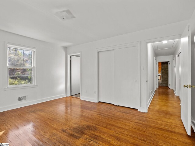 spare room featuring light hardwood / wood-style floors