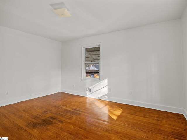 empty room featuring hardwood / wood-style floors