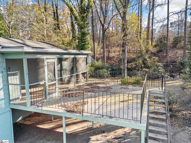 exterior space featuring a sunroom