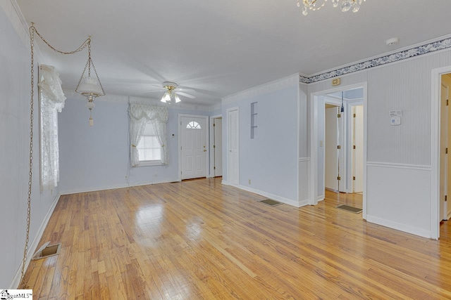 unfurnished living room with ceiling fan and light wood-type flooring