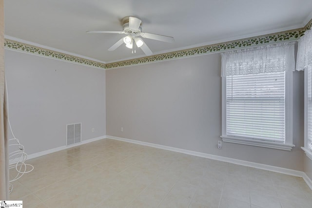 spare room with ceiling fan and ornamental molding