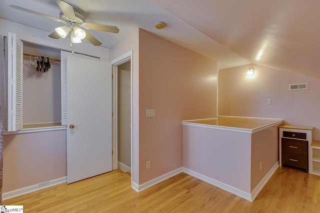 additional living space featuring ceiling fan, light hardwood / wood-style flooring, and lofted ceiling