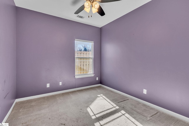 carpeted empty room featuring ceiling fan