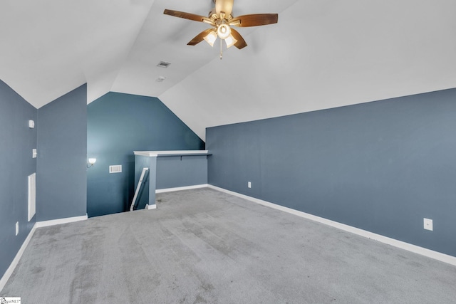 additional living space featuring carpet, ceiling fan, and vaulted ceiling