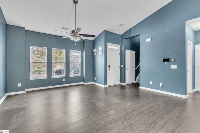 unfurnished living room with lofted ceiling, ceiling fan, and dark hardwood / wood-style floors