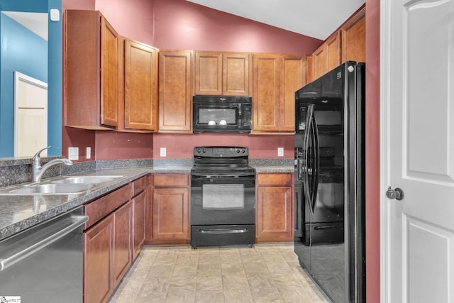 kitchen with black appliances, lofted ceiling, and sink