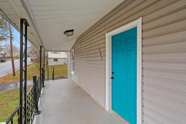 doorway to property featuring a porch