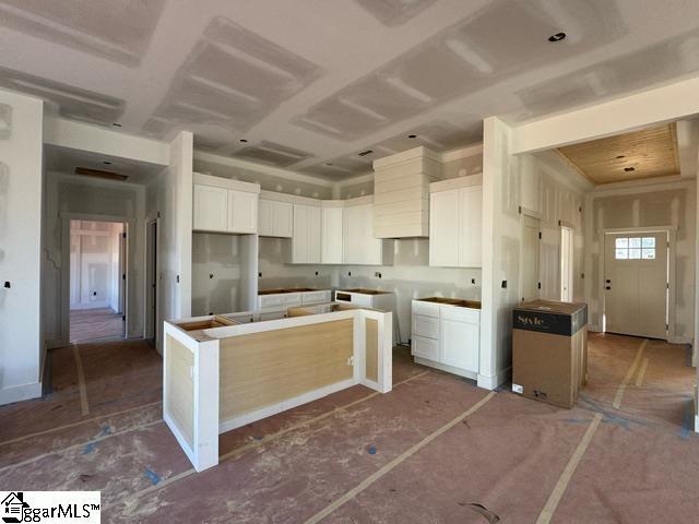 kitchen featuring white cabinetry and a center island