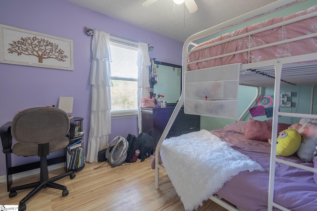 bedroom with hardwood / wood-style flooring and ceiling fan