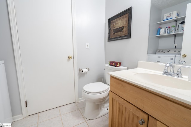 bathroom featuring tile patterned floors, vanity, a textured ceiling, washer / dryer, and toilet