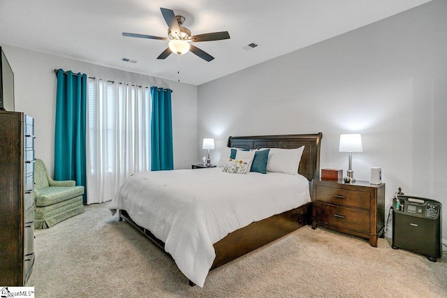 bedroom featuring light carpet and ceiling fan